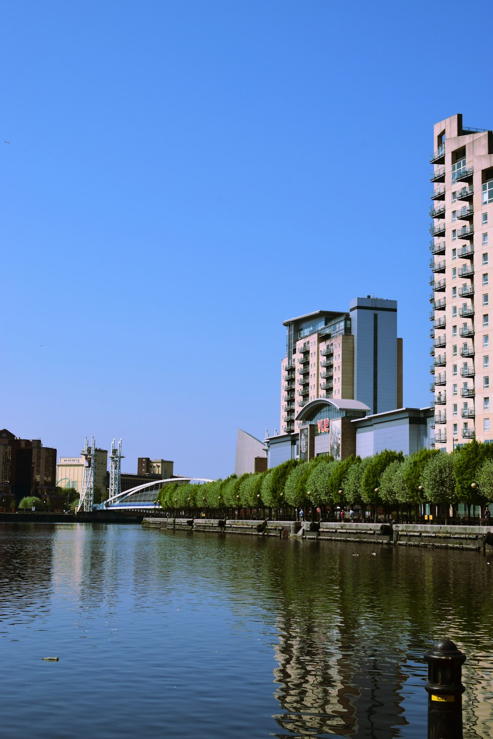 white concrete building near body of water during daytime