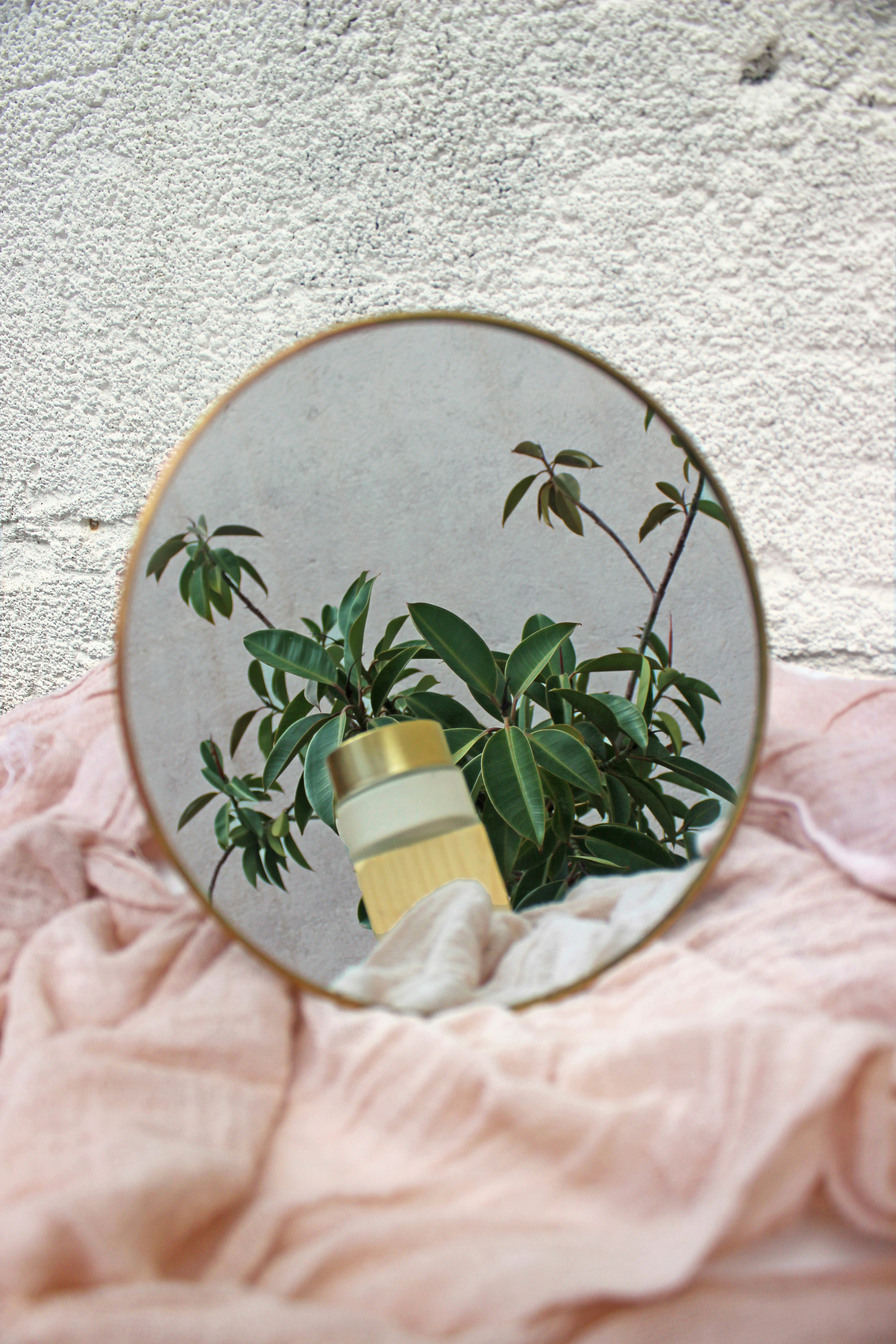 white and green floral round wall decor