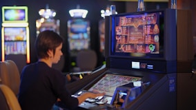 woman in black long sleeve shirt playing arcade game