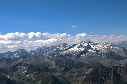 snow covered mountains under blue sky during daytime in Pic du Midi de Bigorre France