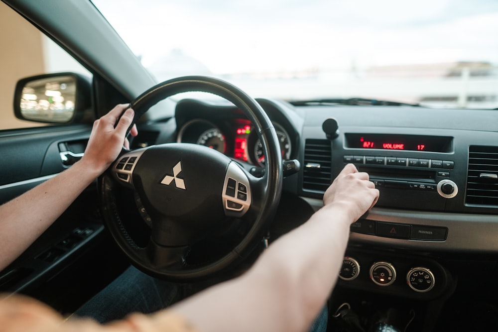 person driving car during daytime