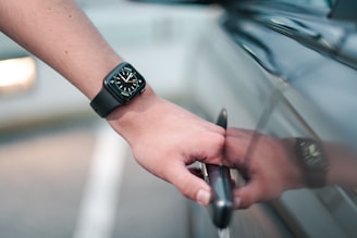 person wearing black digital watch