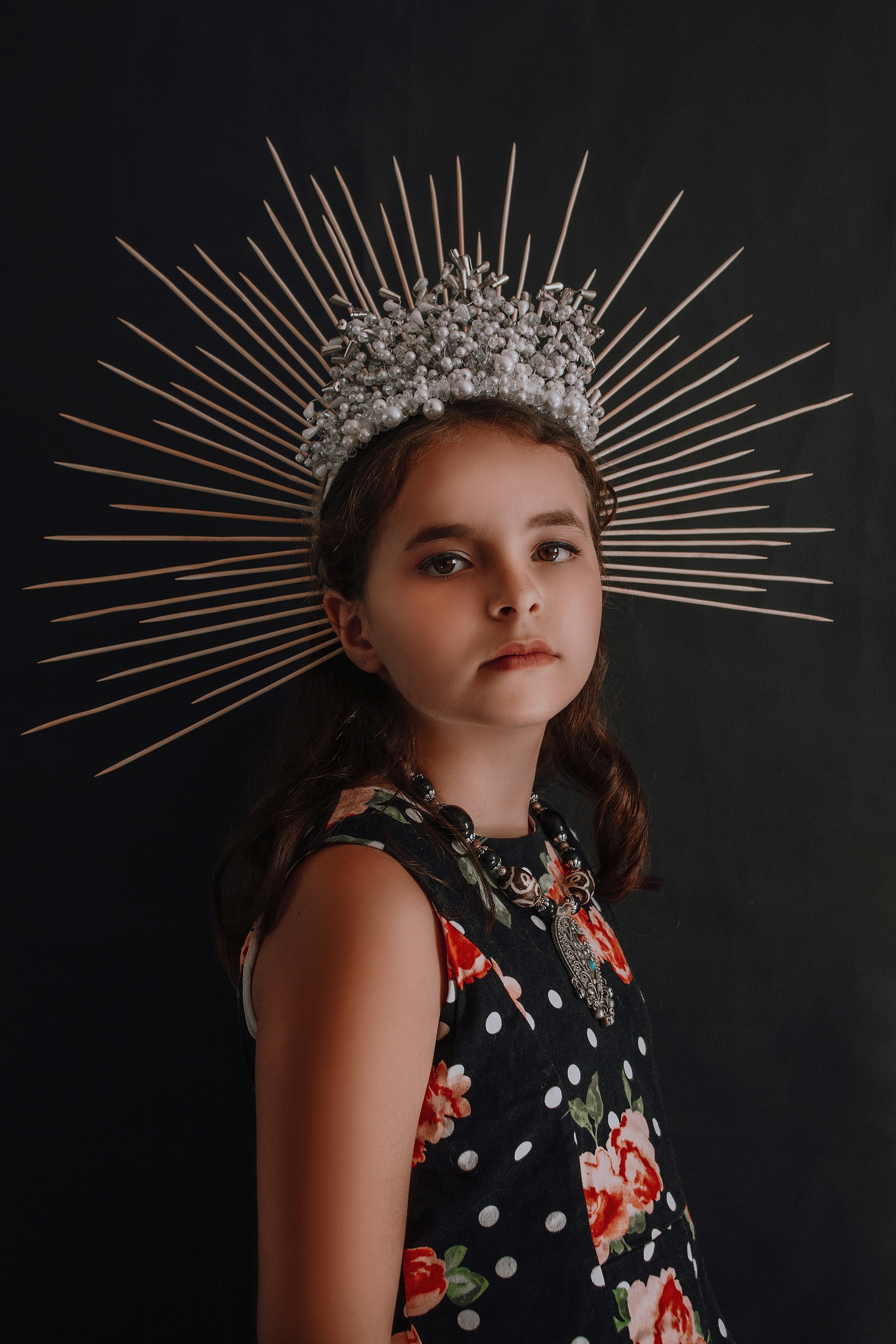 girl in black white and red floral sleeveless dress