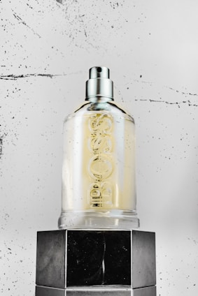 A sleek bottle of Purelift spray stain remover with a fresh lemon scent on a kitchen counter