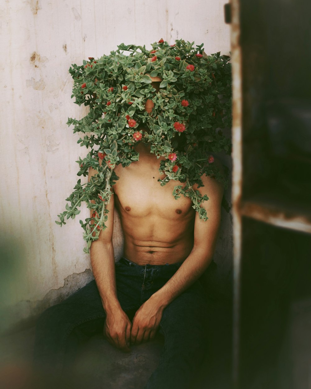 woman in black skirt standing beside green plant