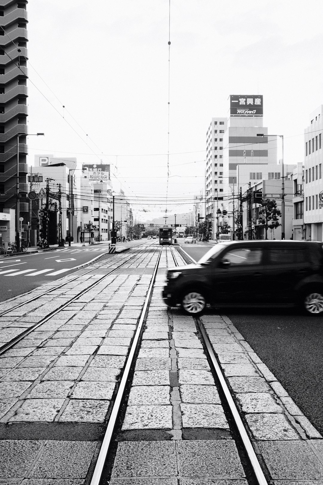 grayscale photo of cars on road