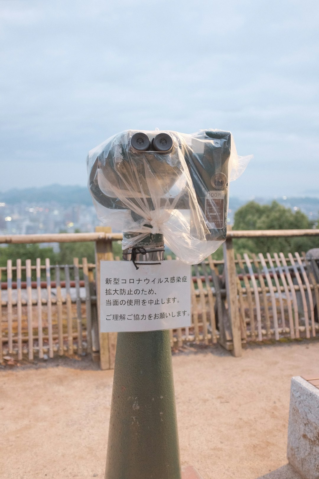 clear plastic bag on green metal post