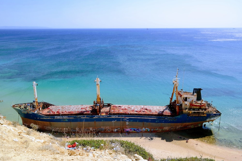 brown ship on blue sea during daytime