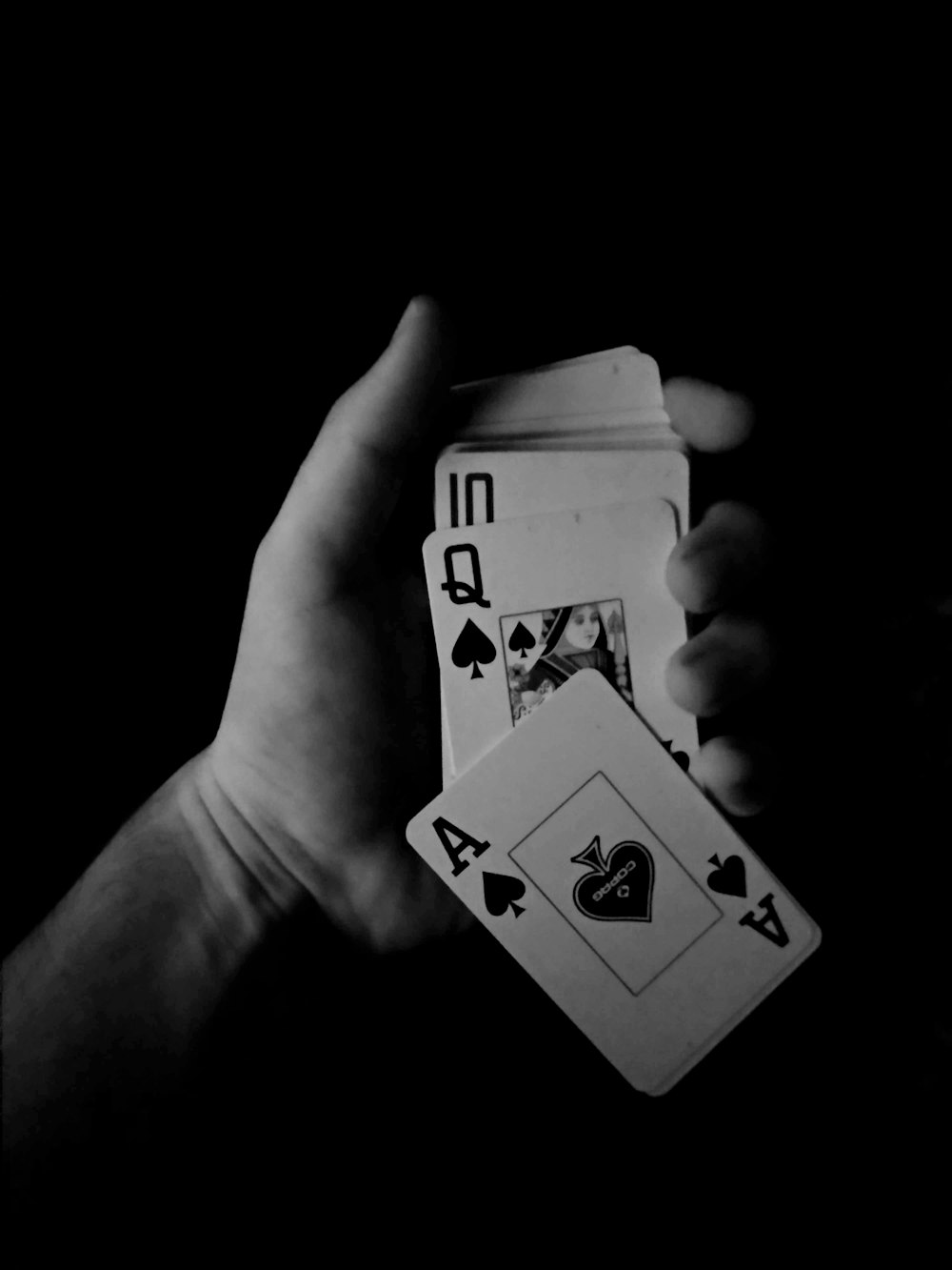 grayscale photo of 2 and 2 of spades playing cards