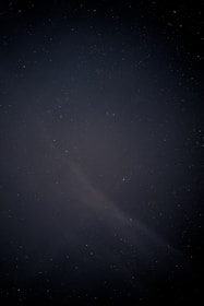 A whimsical constellation map blending mythic symbols with faint, glowing light and shadow.