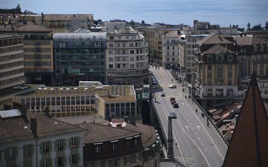 cars on road near buildings during daytime in Lausanne Switzerland