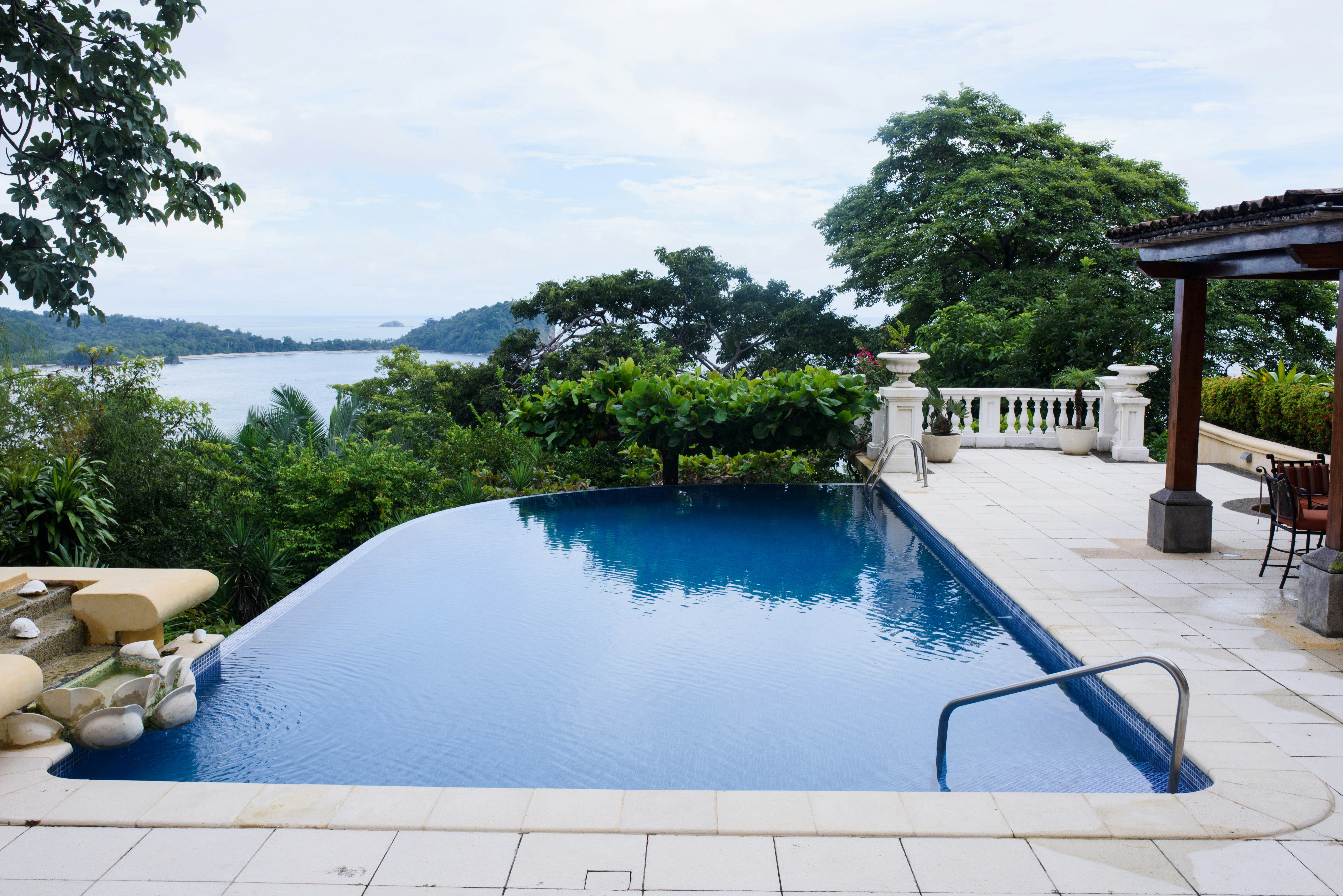 A swimming pool in the jungle in Manuel Antonio, Costa Rica - luxury real estate - tropical villa - vacation home - central america - travel tourism trip infinity pool