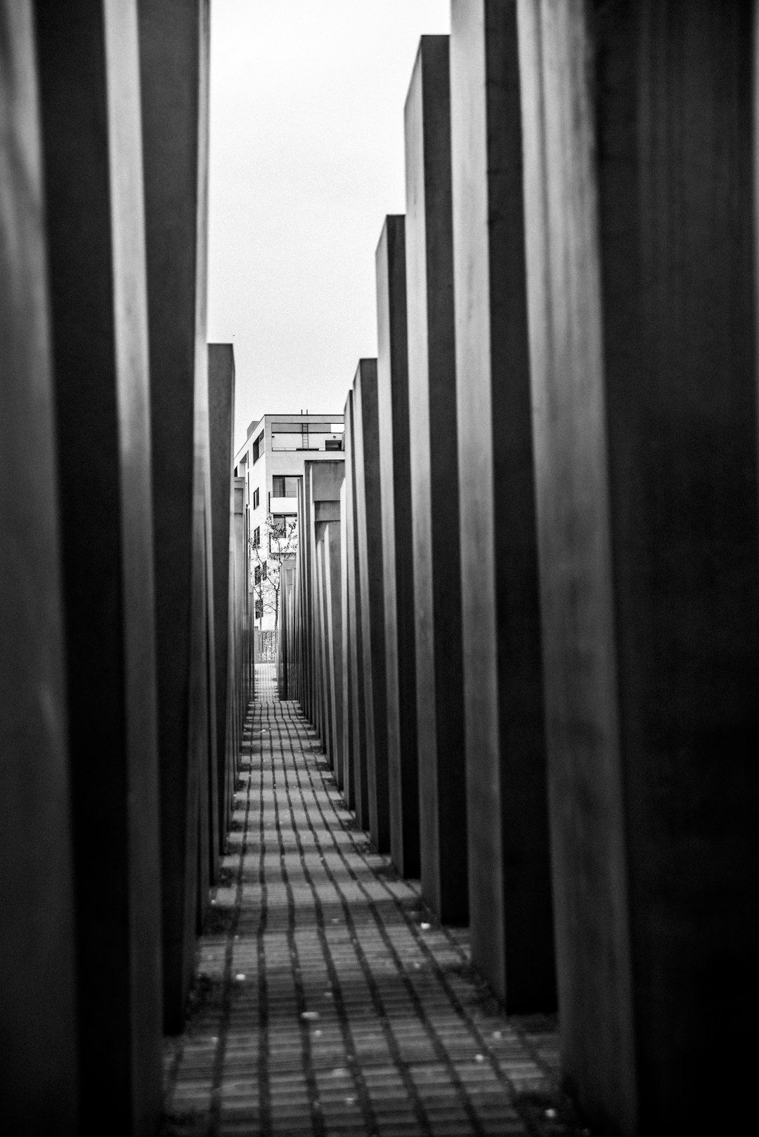 grayscale photo of bridge during daytime