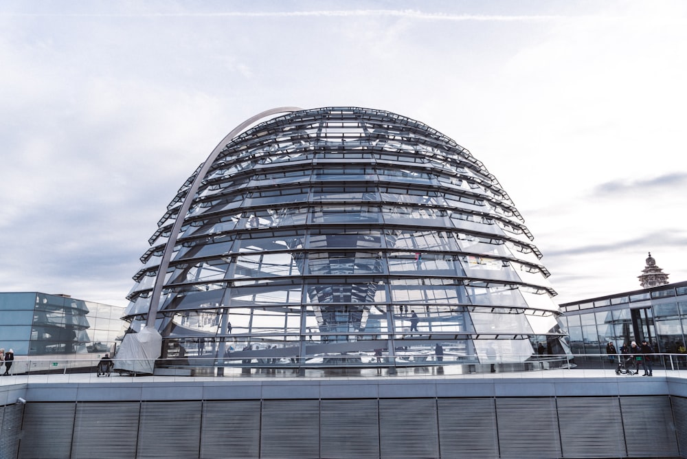 glass building under cloudy sky during daytime