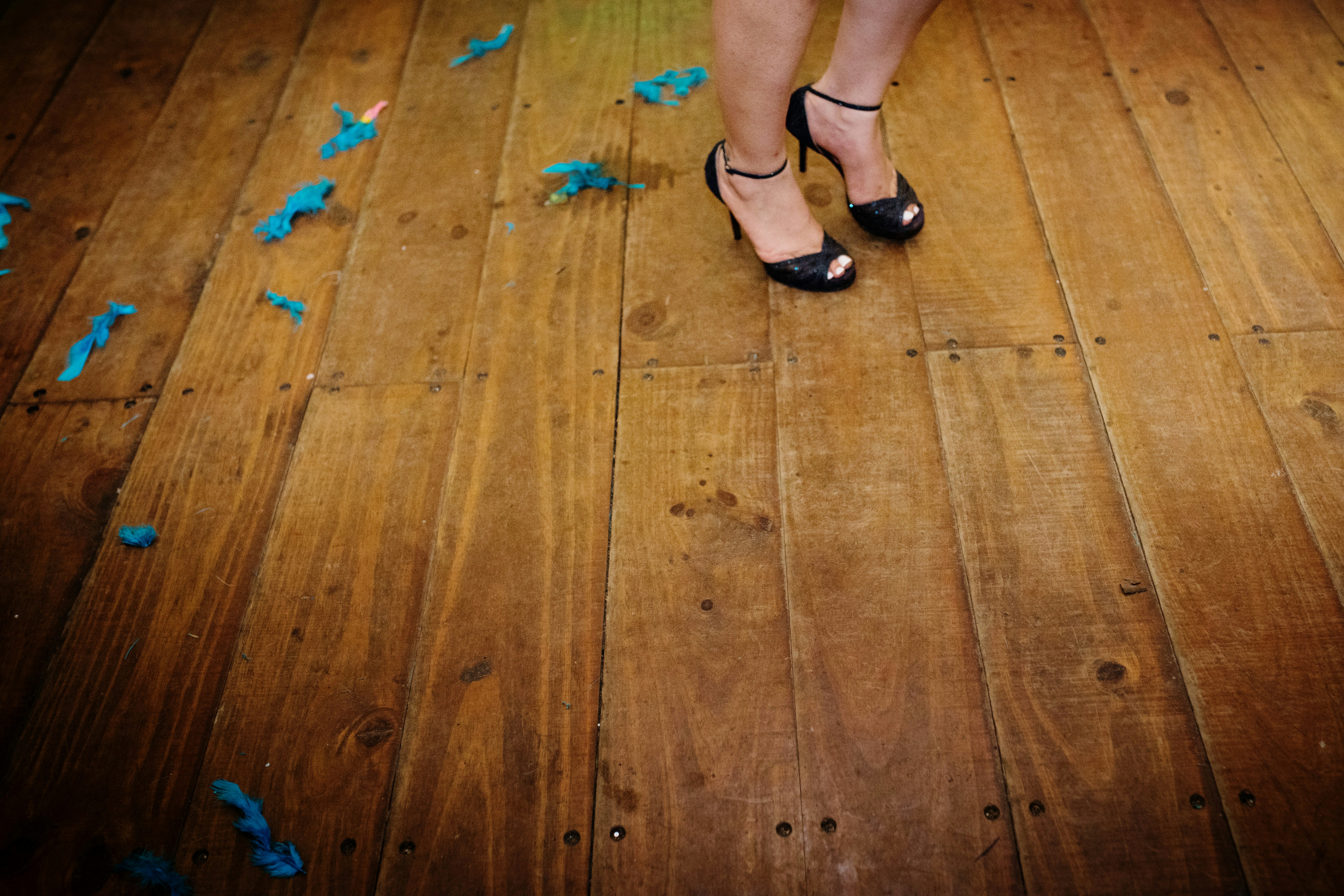 Party high heel shoes purple shoes blue confetti dance floor dancing dance alone solo feet celebrate wedding or reception event last call 