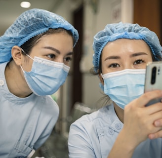 woman in white shirt wearing white mask holding iphone