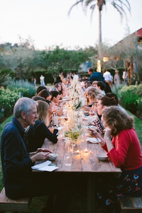 people sitting on chair in front of table during daytime