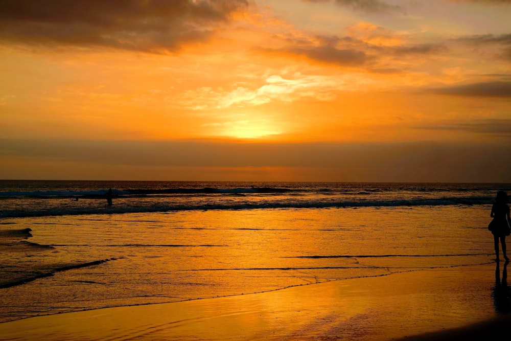 body of water during sunset