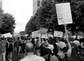 grayscale photo of people walking on street