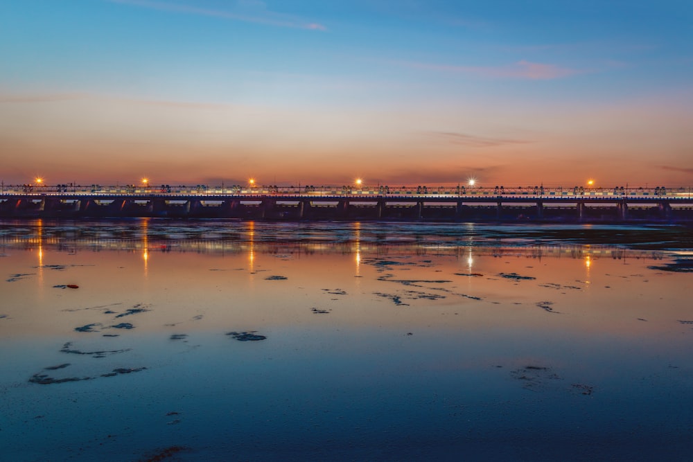 body of water during sunset