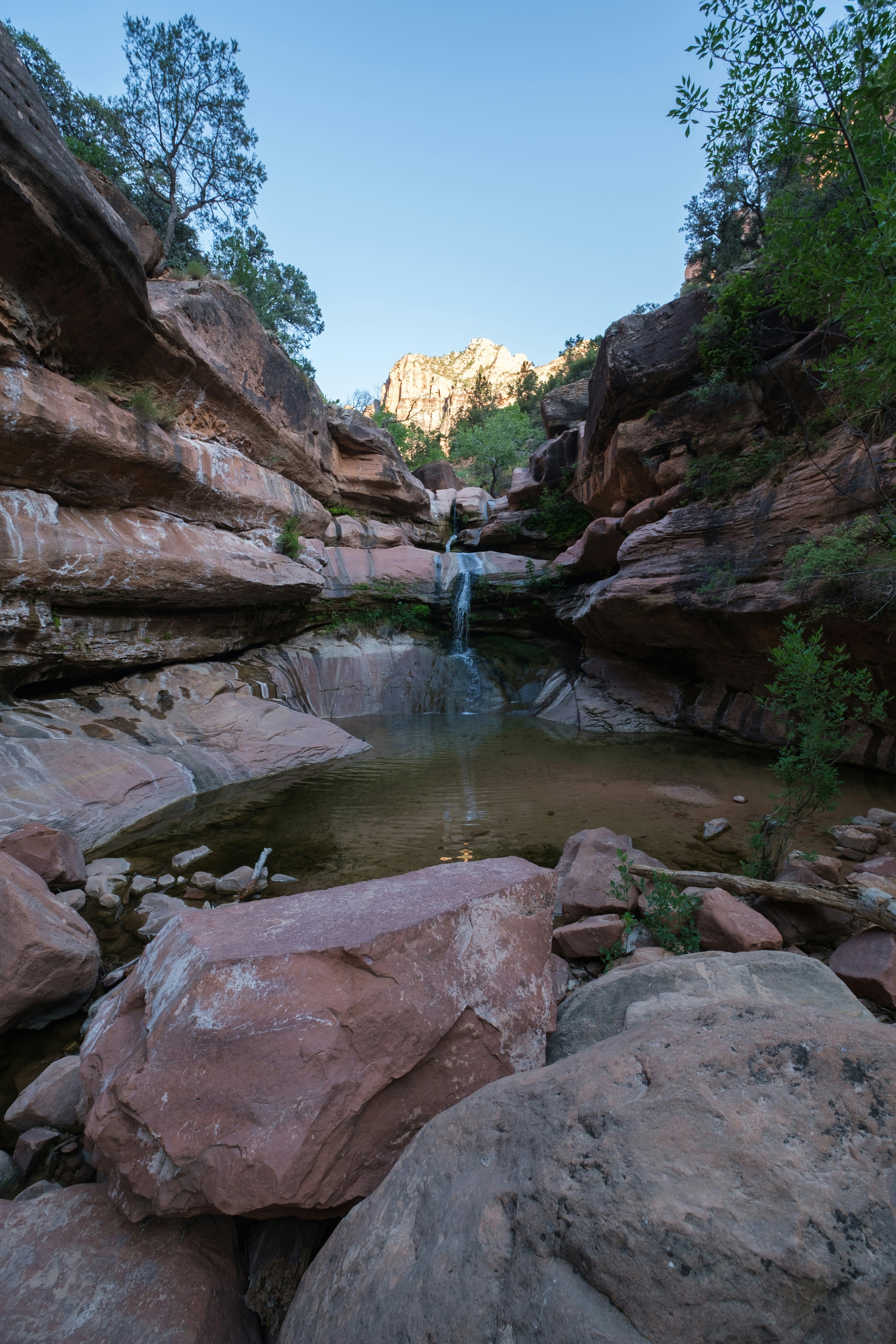 brown rocky mountain with river