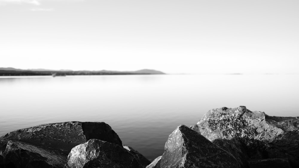 grayscale photo of body of water