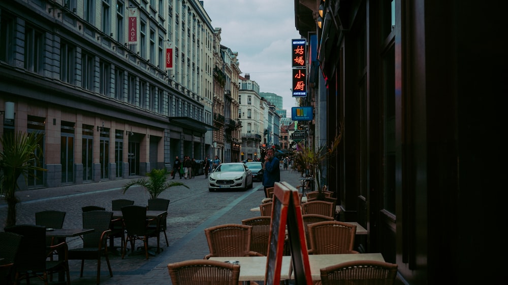 a city street filled with lots of tables and chairs