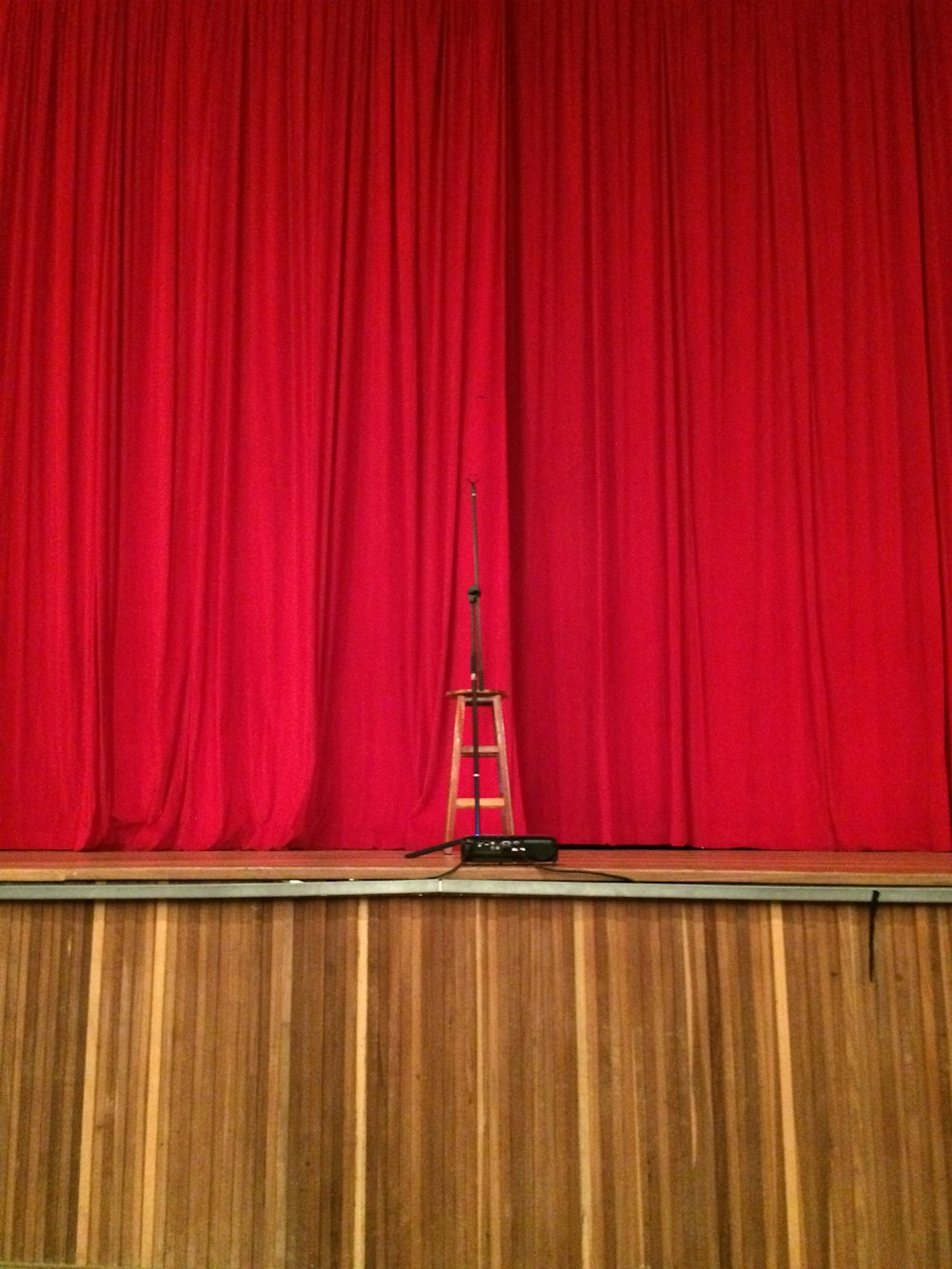 red curtain on brown wooden floor