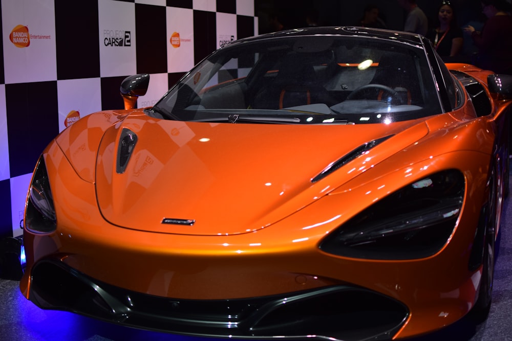 orange ferrari car in a garage