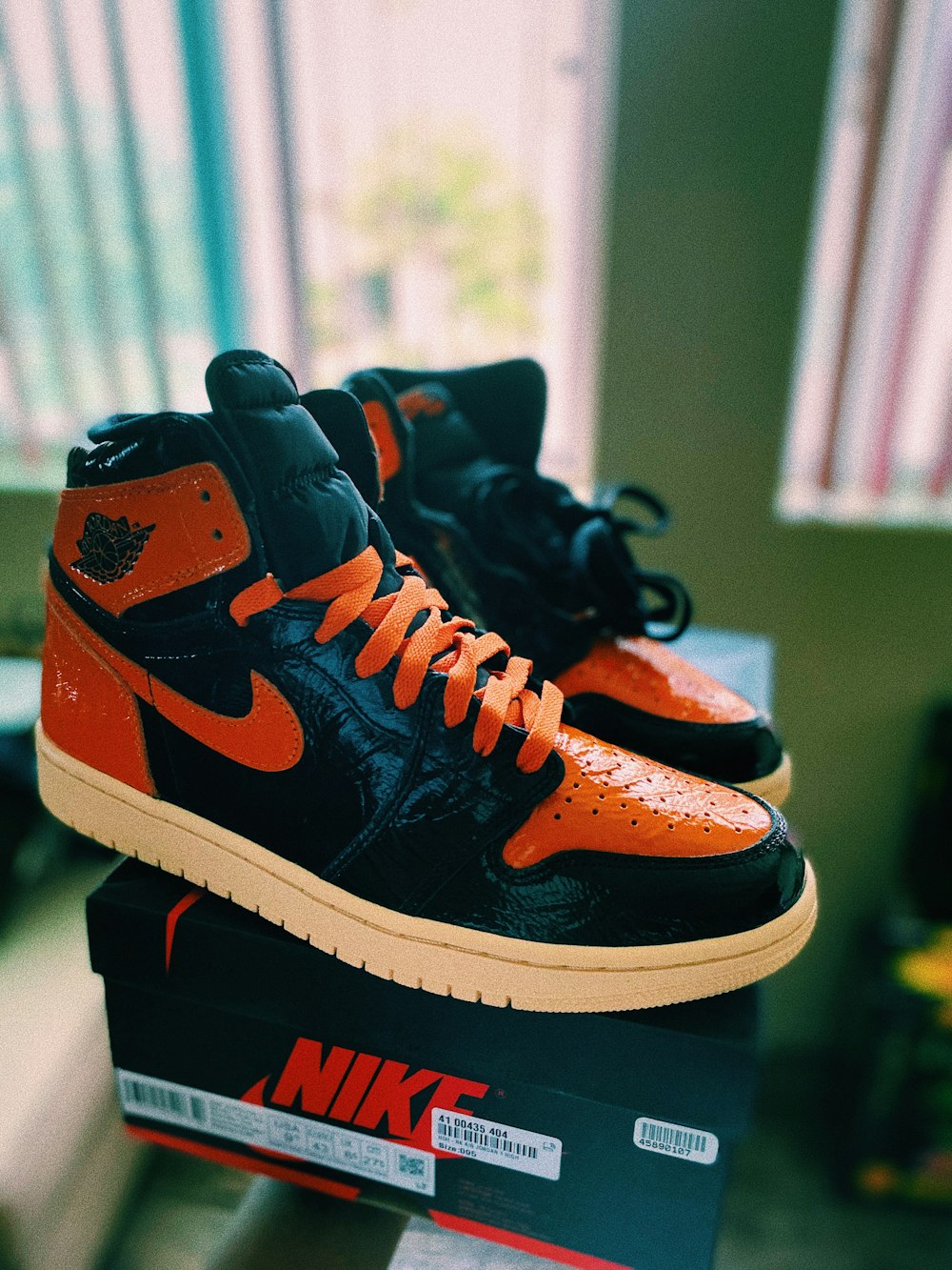 Black and orange nike high top sneakers photo – Free Footwear Image on  Unsplash