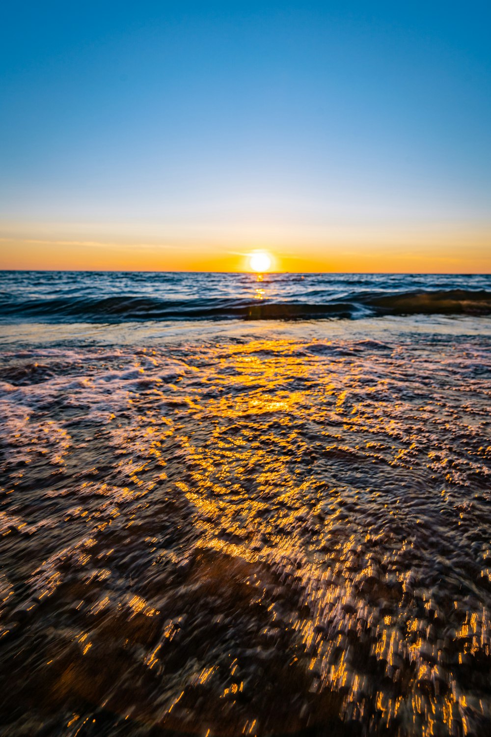 body of water during sunset