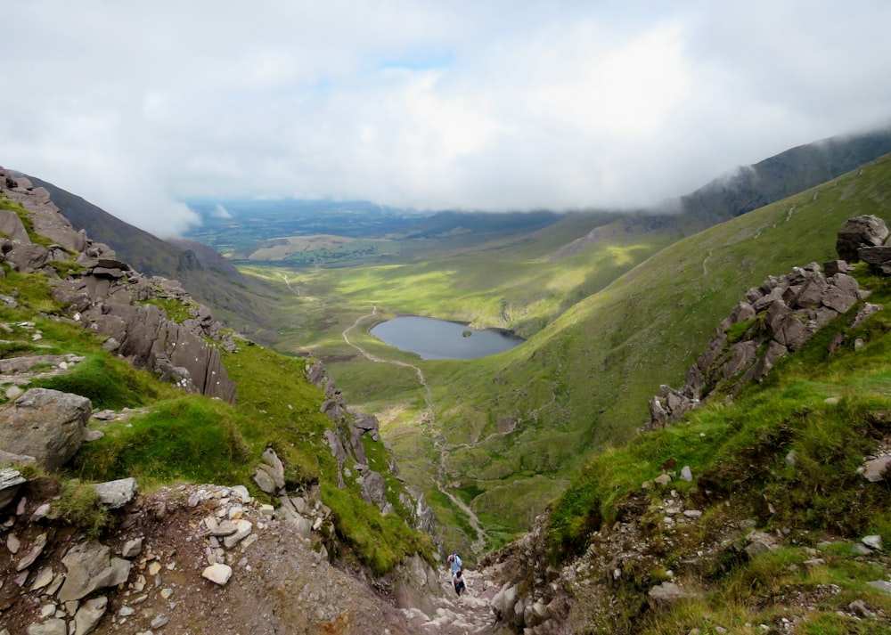 green mountains under white clouds during daytime