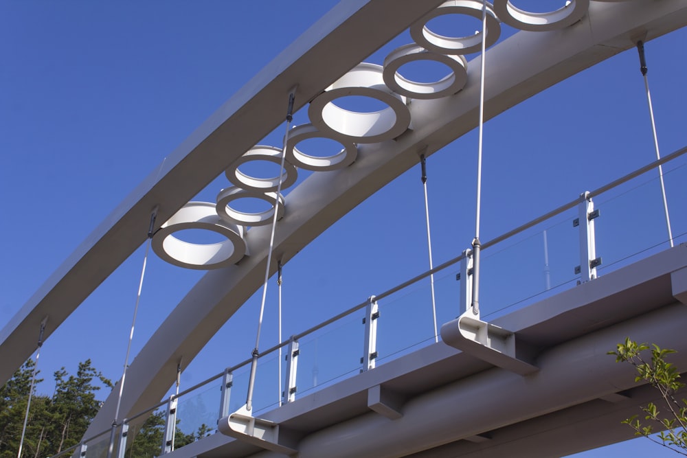 white metal bridge under blue sky during daytime