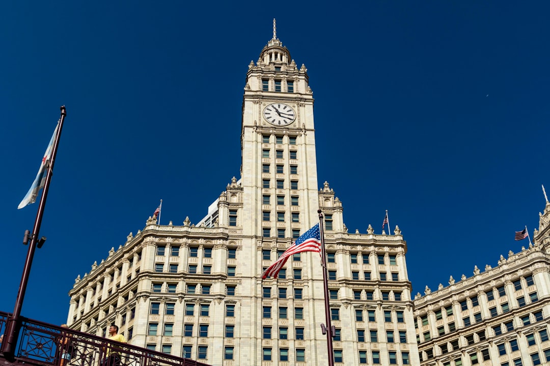 white concrete building with us flag on top during daytime