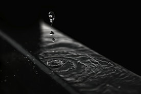 water droplets on black surface