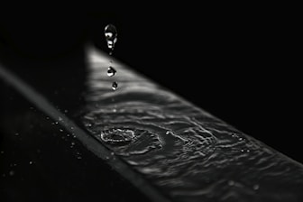 water droplets on black surface