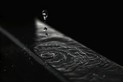 water droplets on black surface