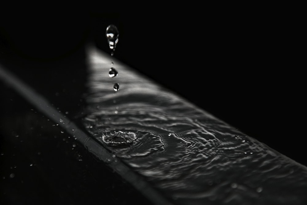 water droplets on black surface