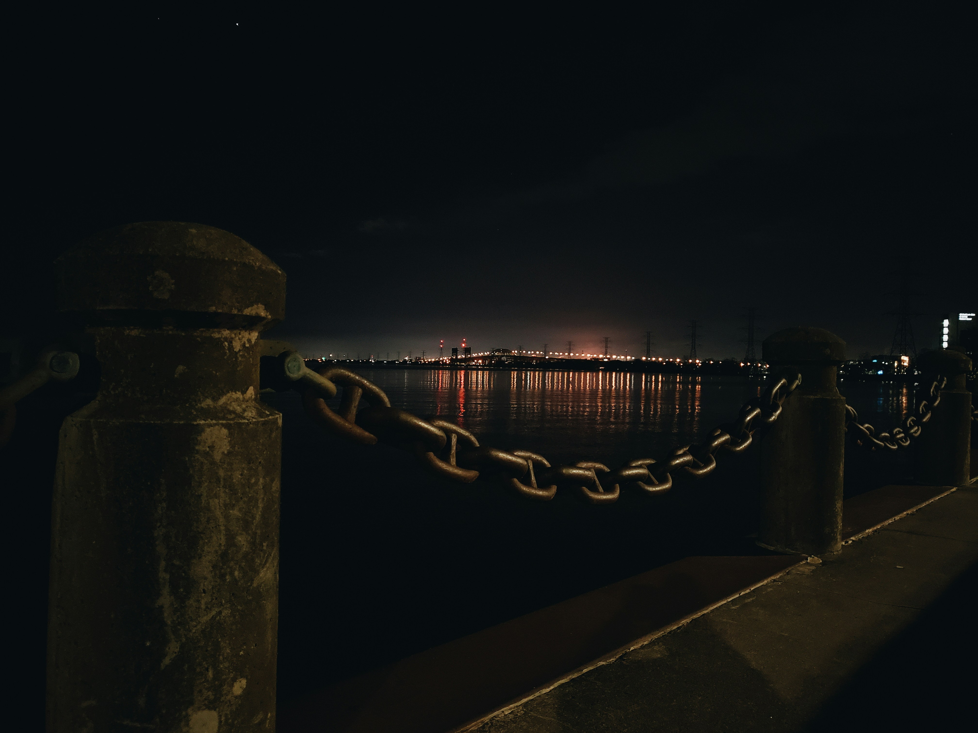 brown metal chain link fence during night time