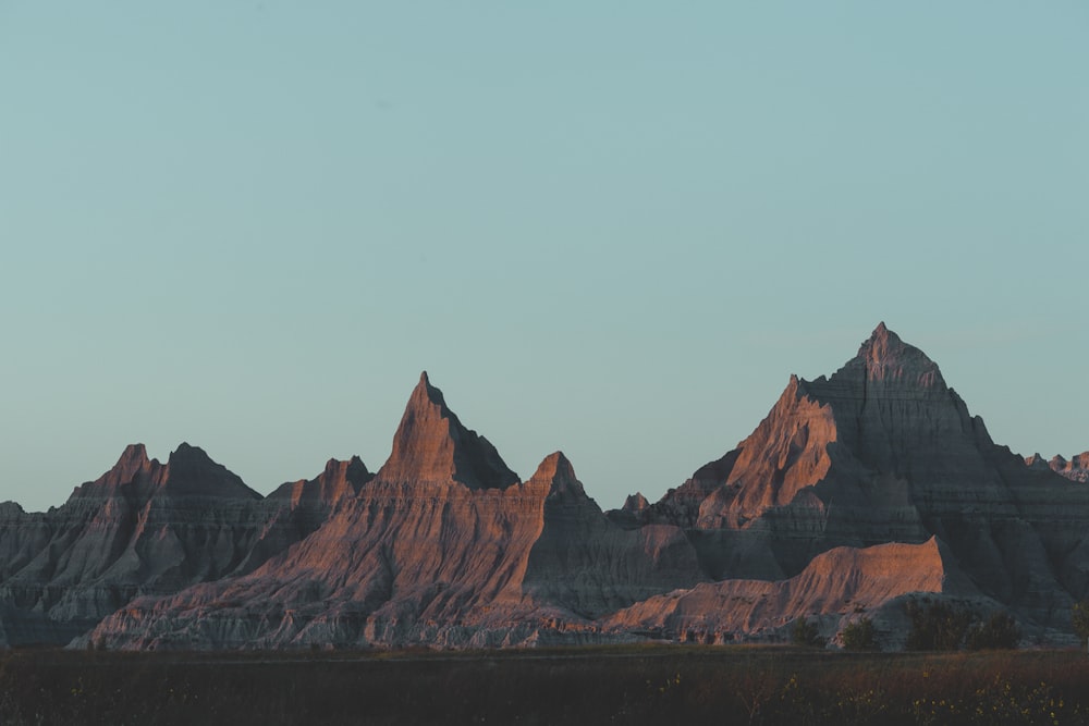 brown rocky mountain under white sky during daytime