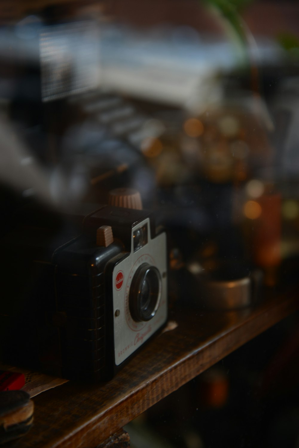 black and silver camera on brown wooden table