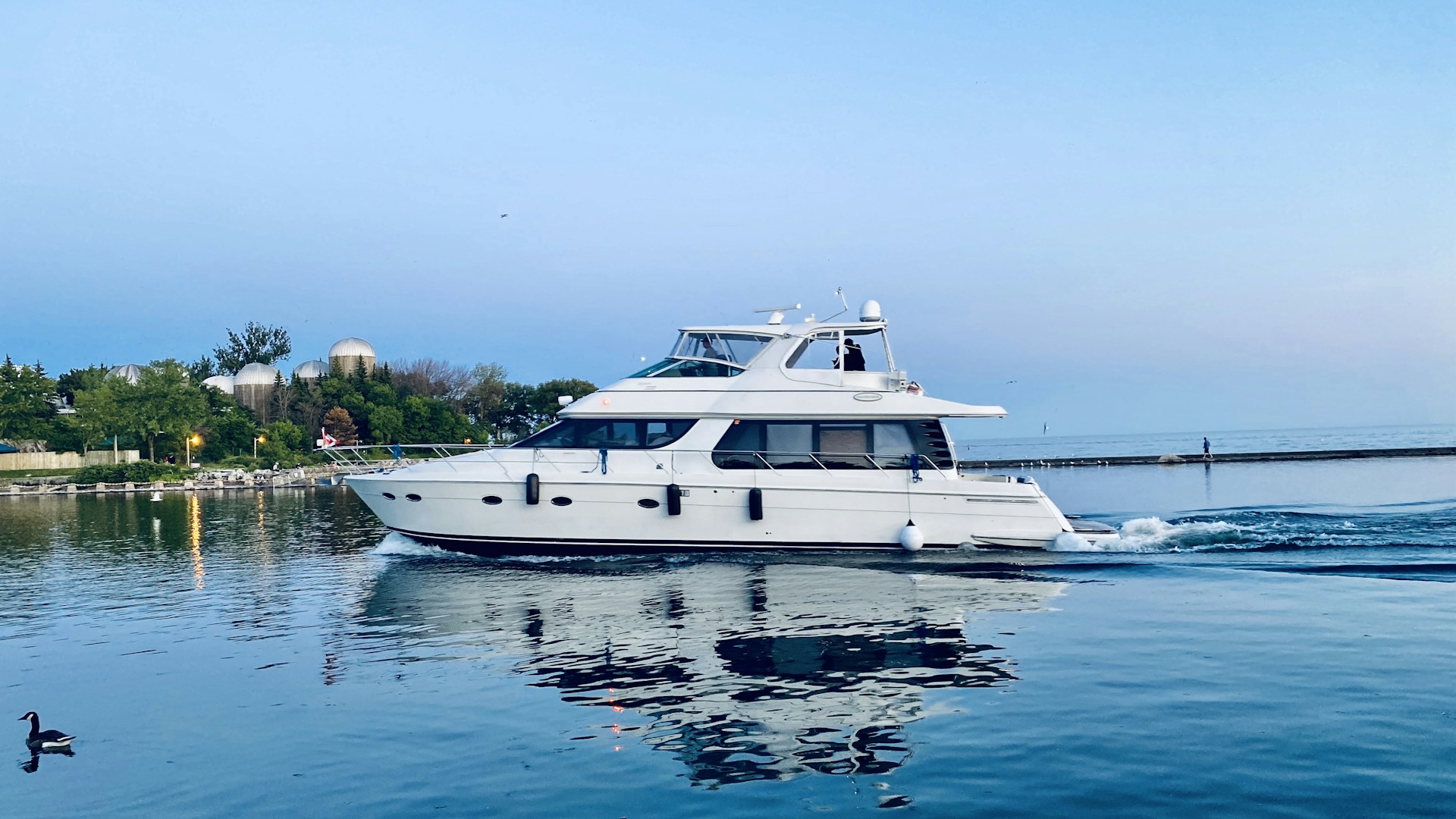white yacht on body of water during daytime