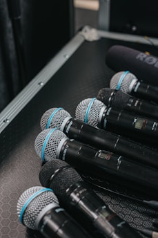 black and silver microphone on black table