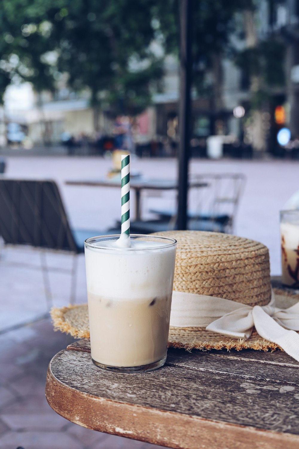 white and brown ice cream in clear plastic cup