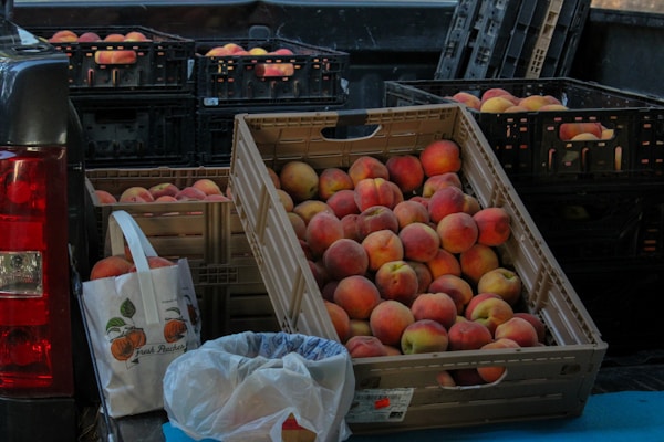 Red apples on brown wooden crate