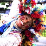 woman in white red and blue floral scarf
