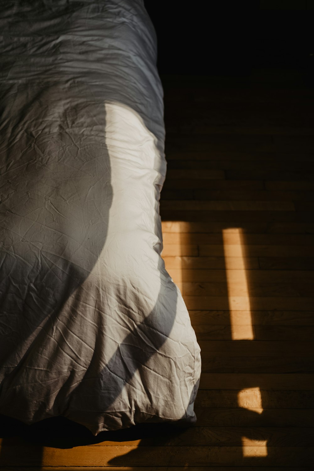 white pillow on purple bed