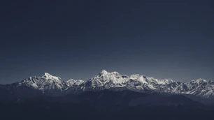 snow covered mountain under blue sky during daytime