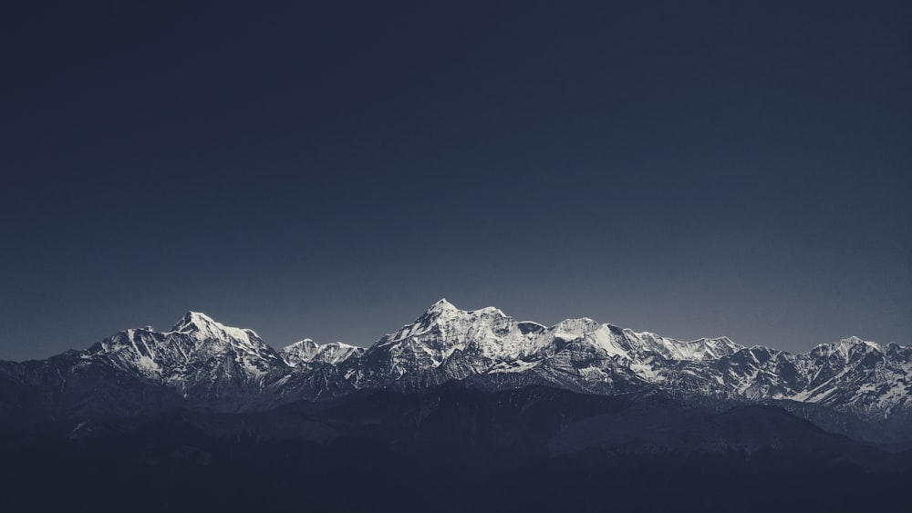 snow covered mountain under blue sky during daytime