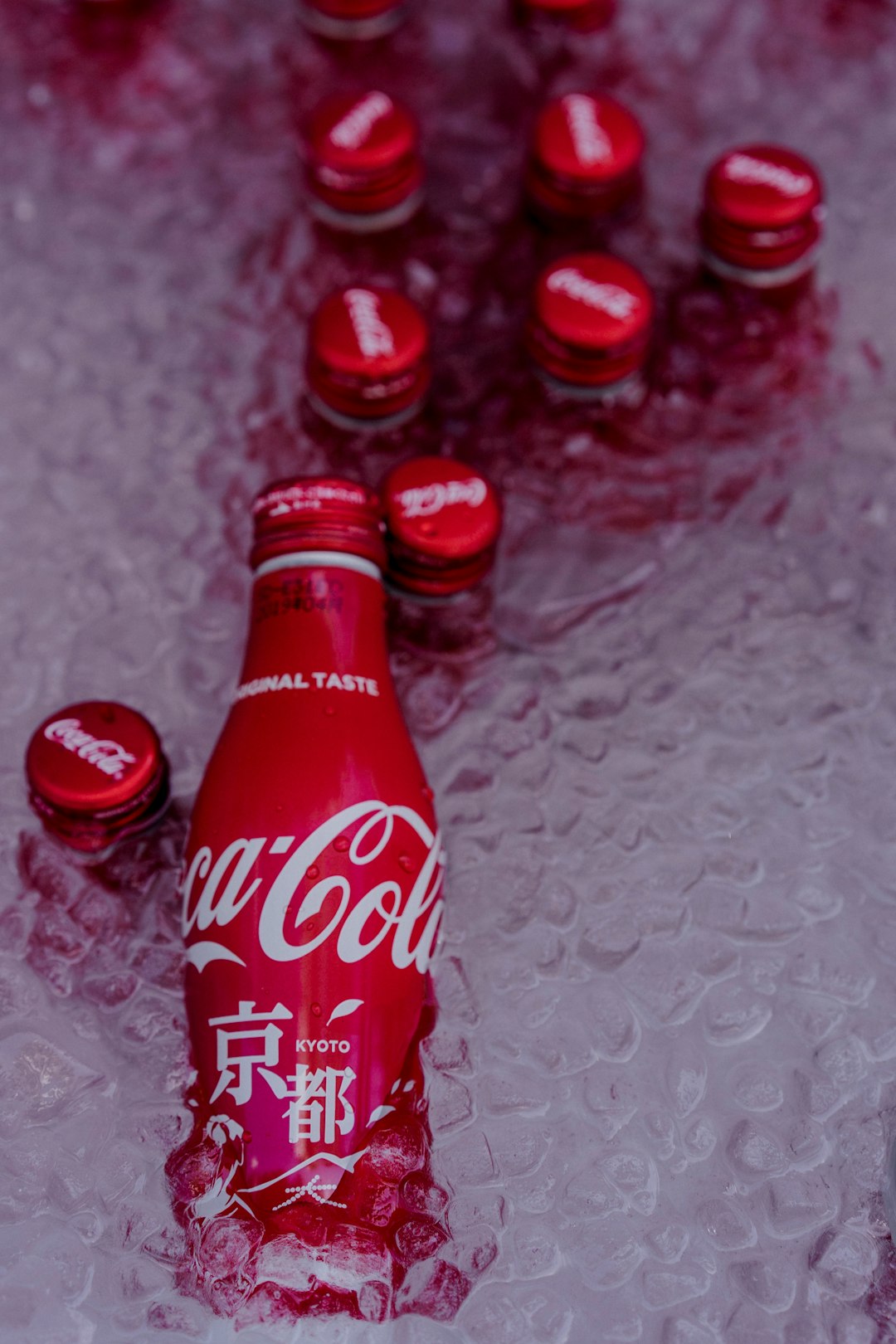 coca cola bottle on white textile